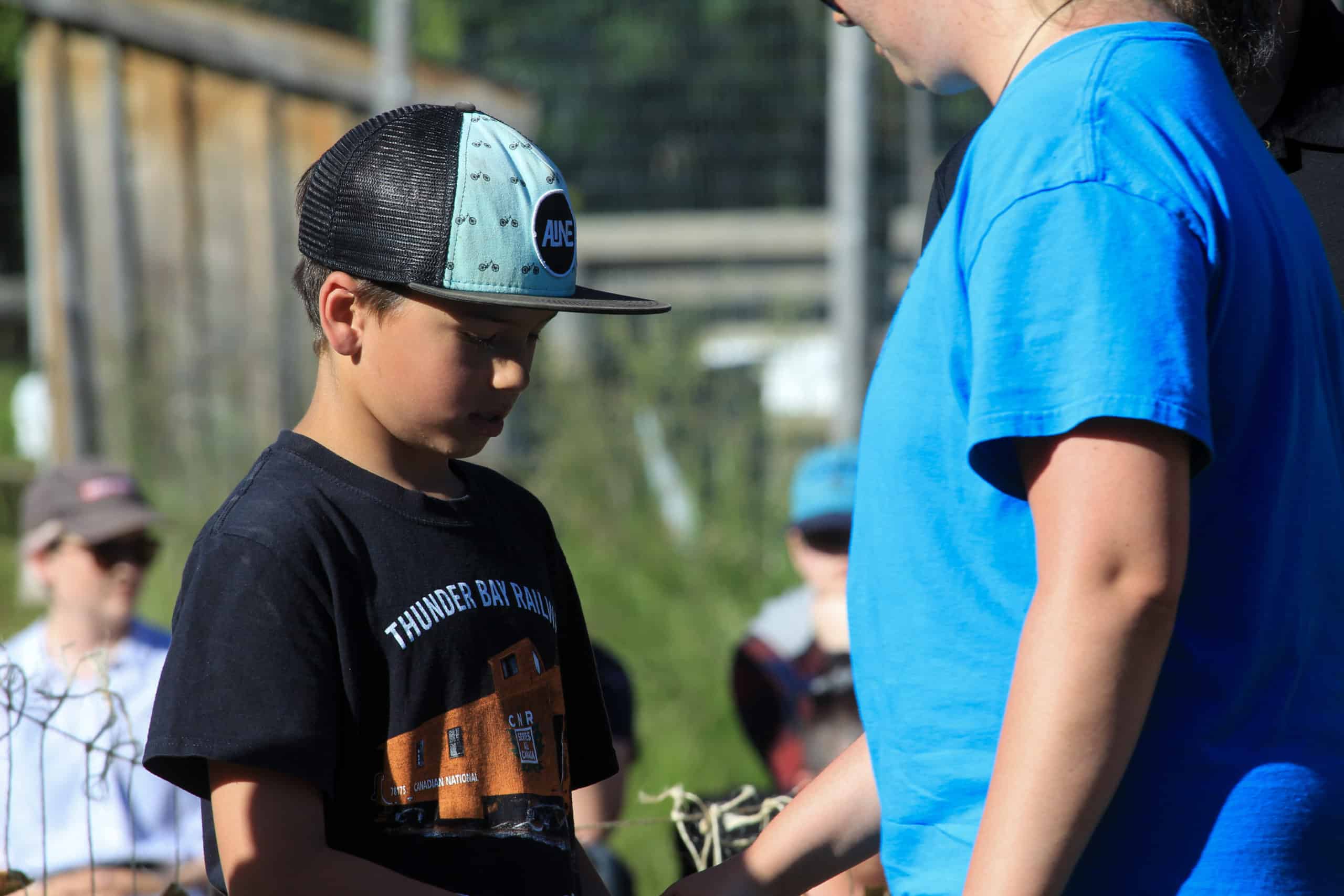Student, Simon Gleeson, shakes hands with a staff member