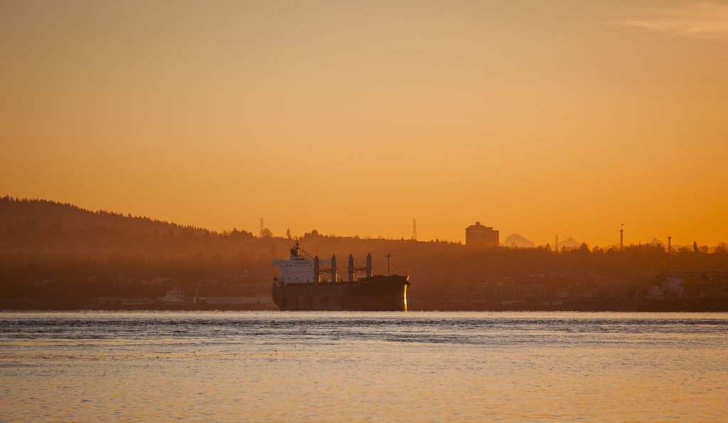 Tankers load oil in the Burrard Inlet, a port of Vancouver. Today, about one tanker loads up each week; if the second Trans Mountain pipeline opens, the rate will increase to one a day. Darren Hauck for Reveal