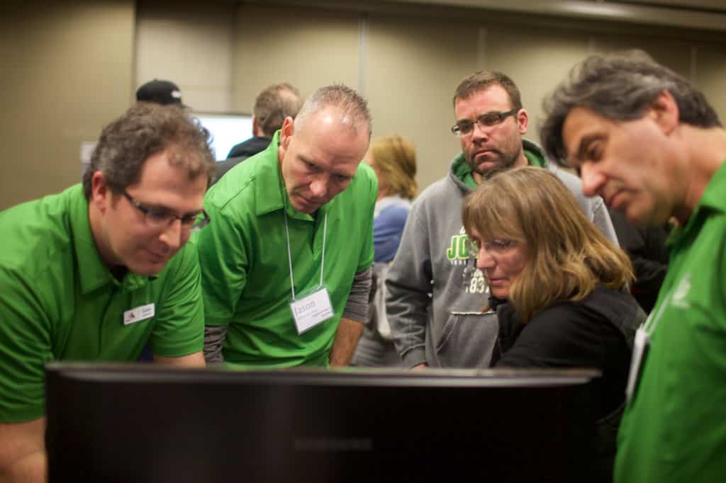 Kinder Morgan workers, dressed in matching green outfits, host an information session about the Trans Mountain pipeline project in Kamloops, British Columbia. Patrick Michels for Reveal