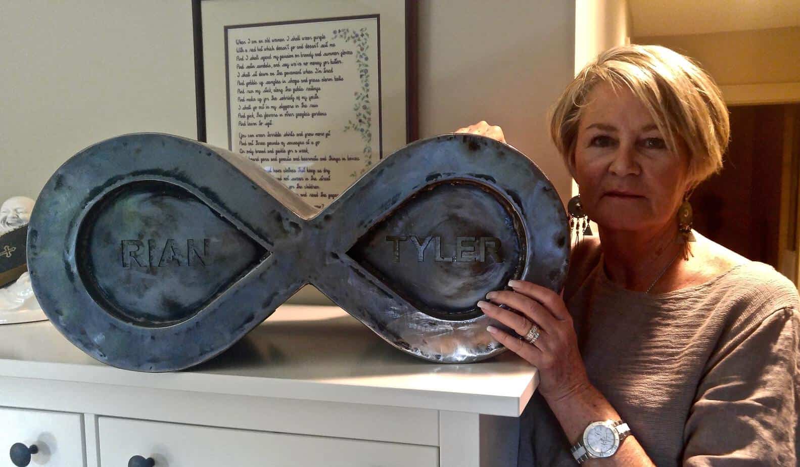 Helen Jennens stands with the urn of her two sons, Tyler and Rian, who died from drug overdoses five years apart. Helen says she advocates for improved addictions services to honour their illness. Trevor Jang