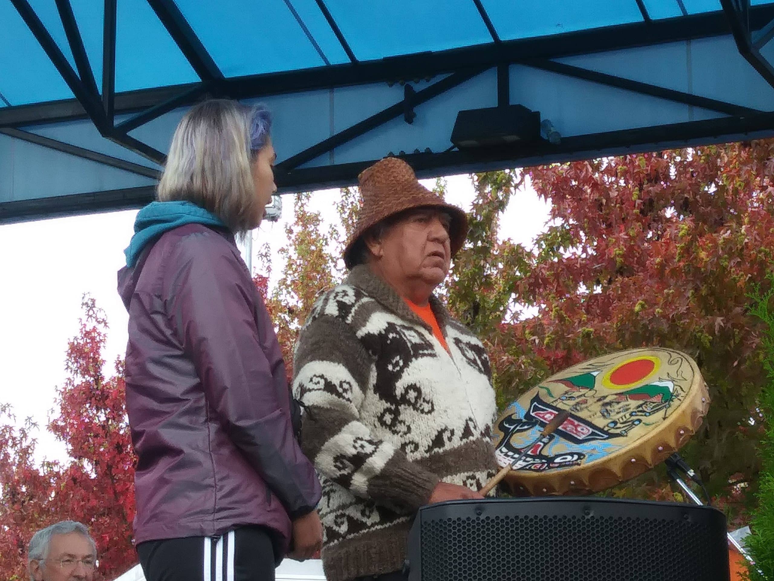 Elder Gary Manson and his granddaughter sing a song for the crowd on Sept. 30 side by side on stage.