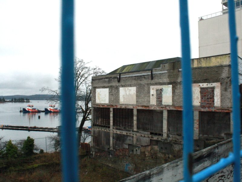 A fence surrounds the waterfront property of 10 Front Street Nanaimo. The site is now a hole of rubble.