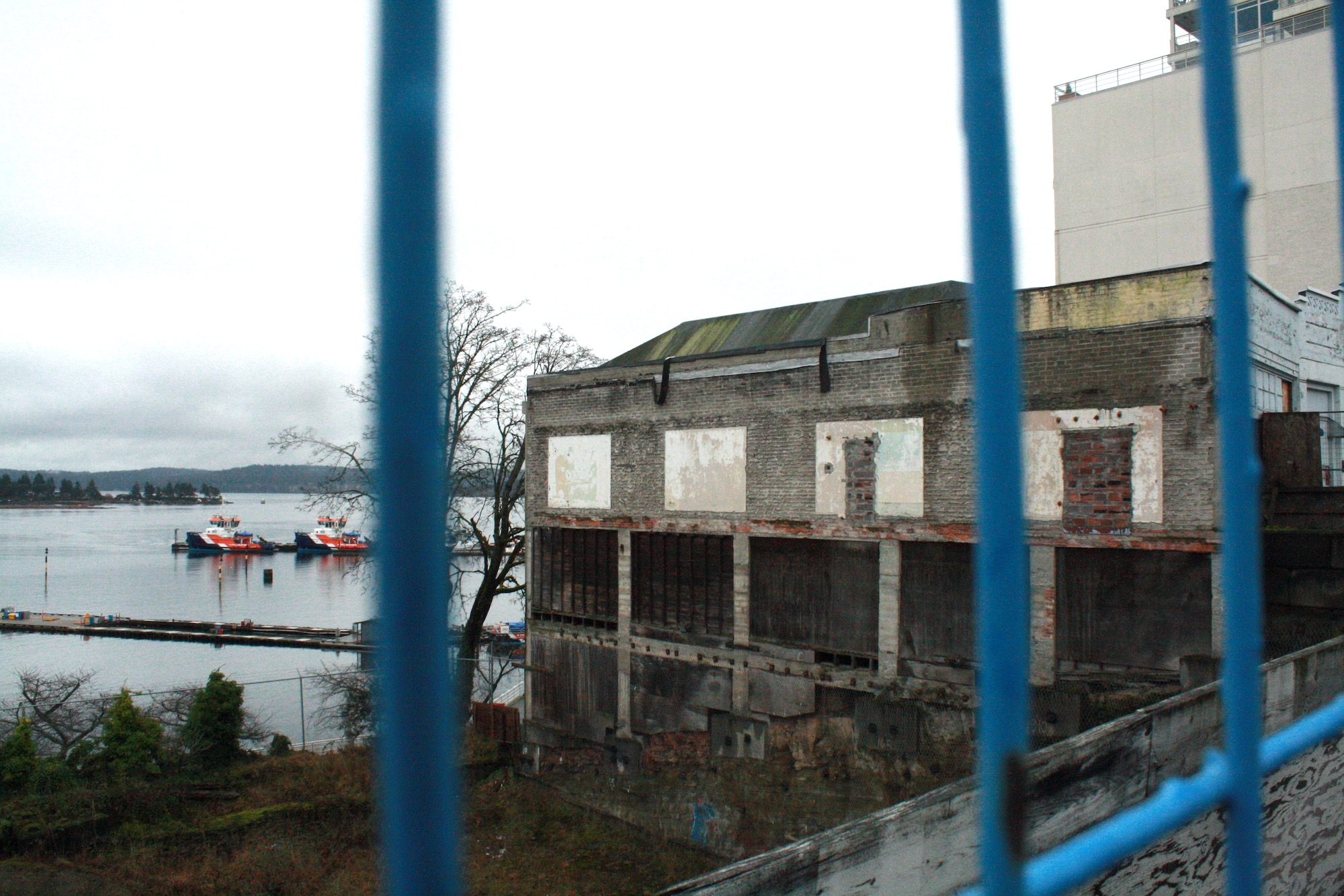 A fence surrounds the waterfront property of 10 Front Street Nanaimo. The site is now a hole of rubble.