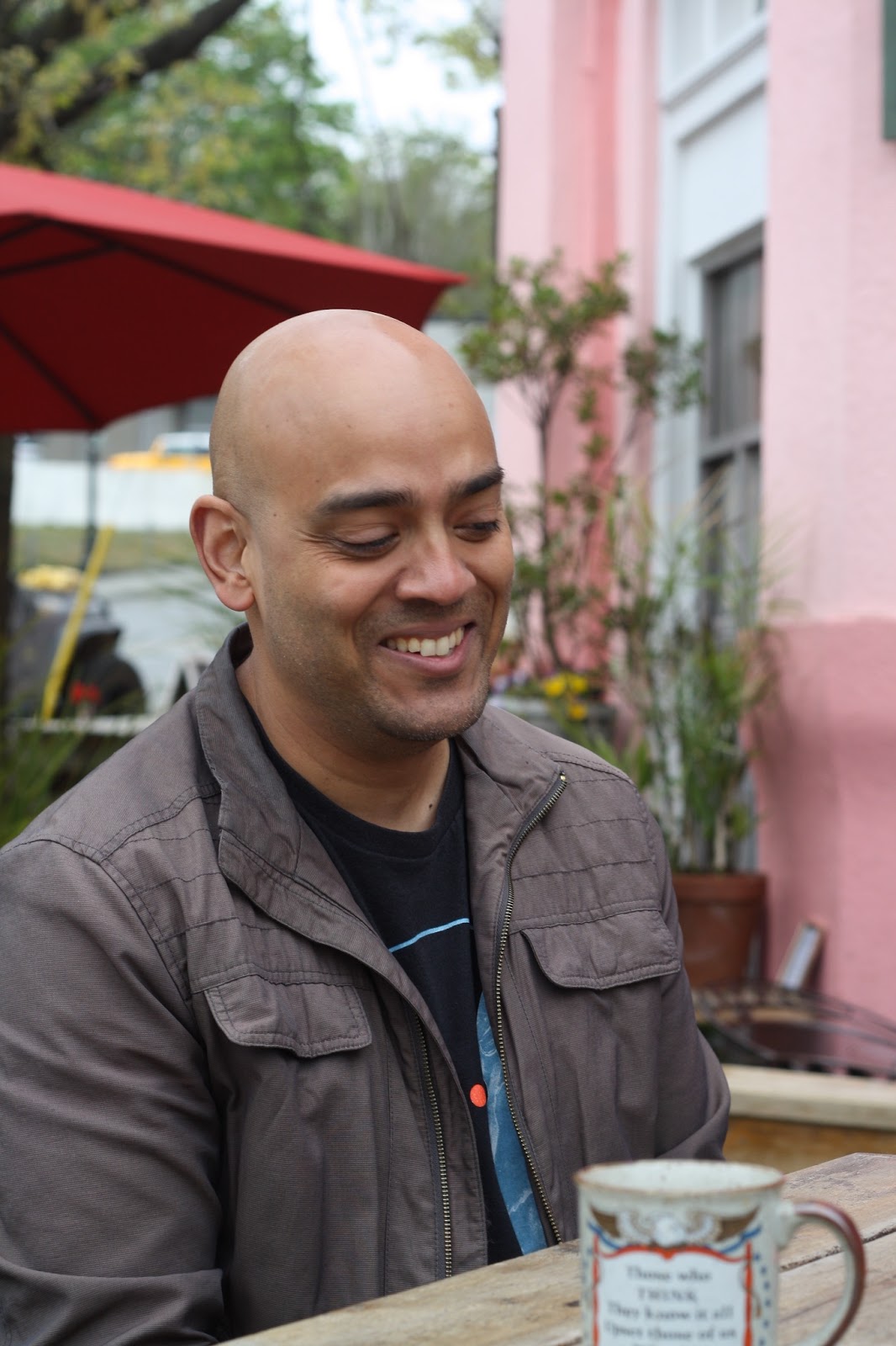 Local promoter Andrew Roberts sits on The Vault patio smiling.
