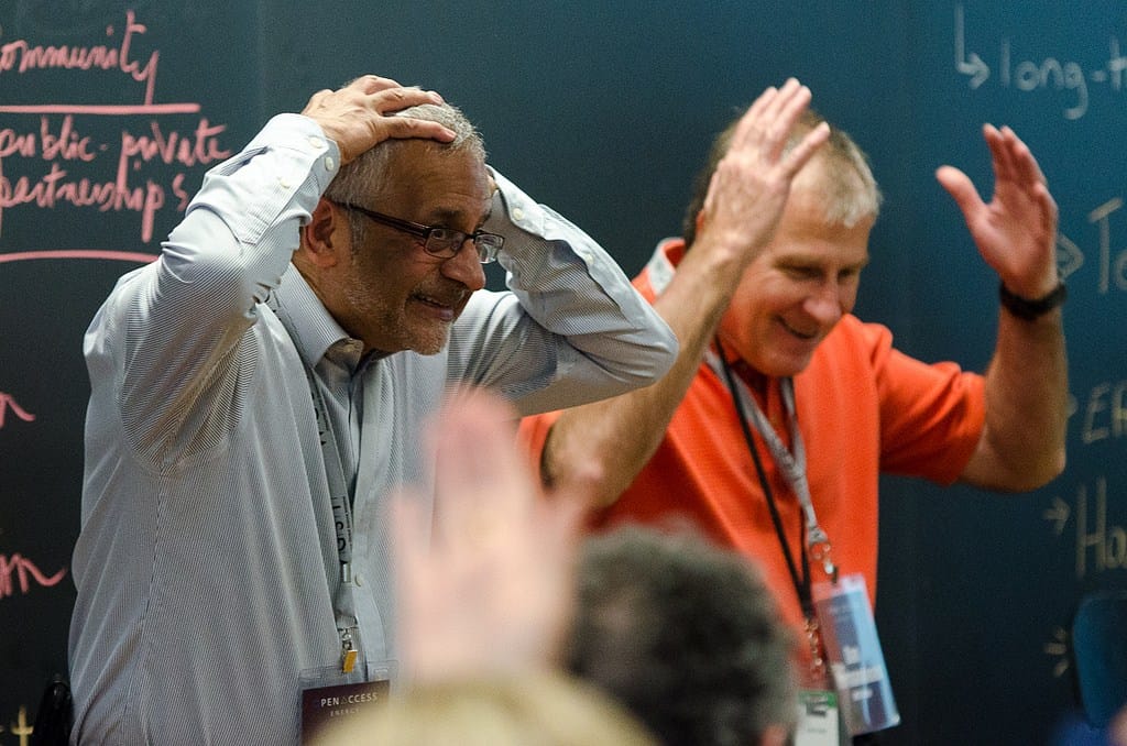 Professor Jatin Nathwani and OpenAccess facilitator Dan Normandeau demonstrate that you don’t have to be a kid at summer camp to enjoy a round of “If You’re Happy and You Know It.”Michael Bennet