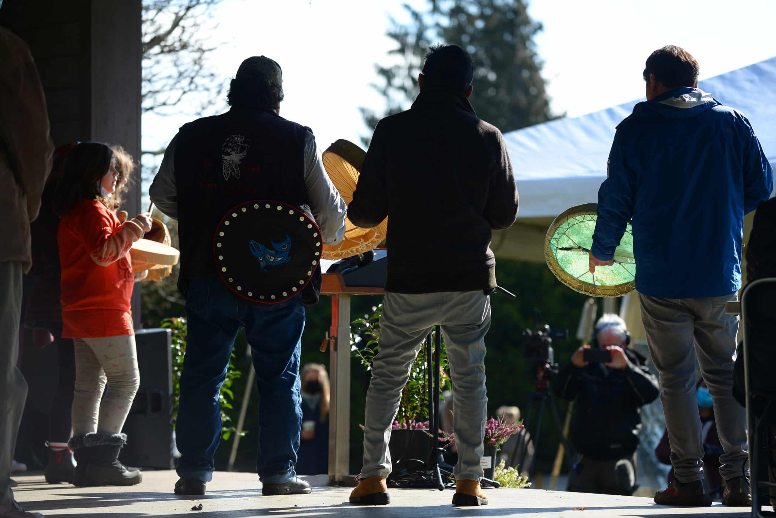 SC’IA⁄NEW First Nation Chief Russ Chipps (right) drums with others at the announcement of an agreement to explore the possibility of an Indigenous protected area at Mary Hill.