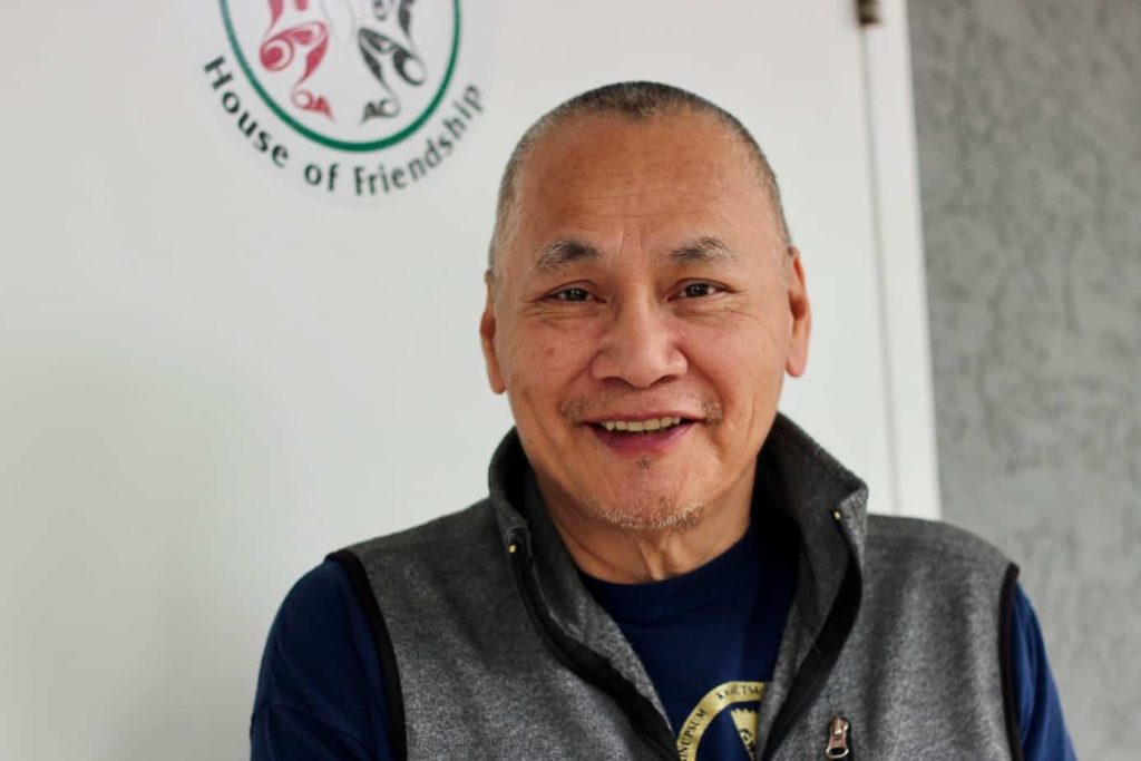 Photo of a smiling man.