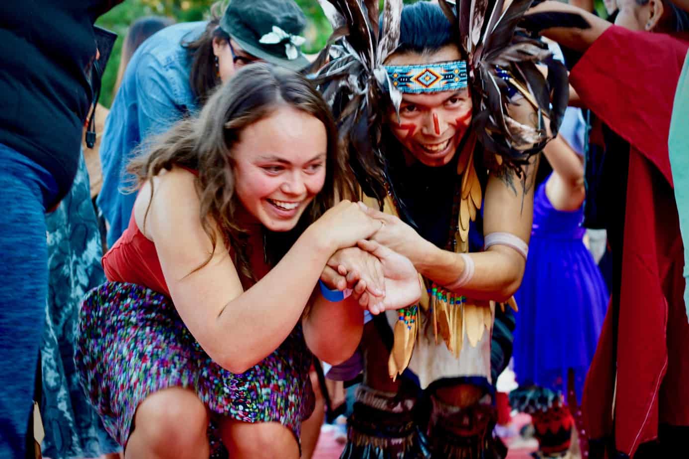 Dancers make their way through a human tunnel during the Koksilah Music Festival near Duncan, B.C.