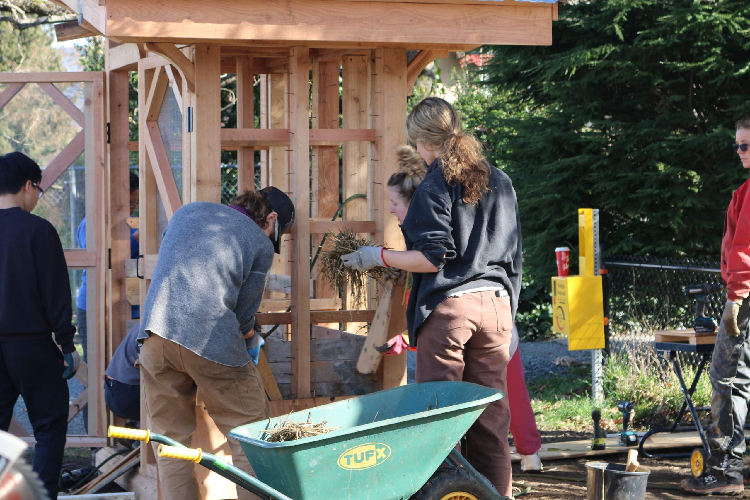 Volunteers help build the food pantry
