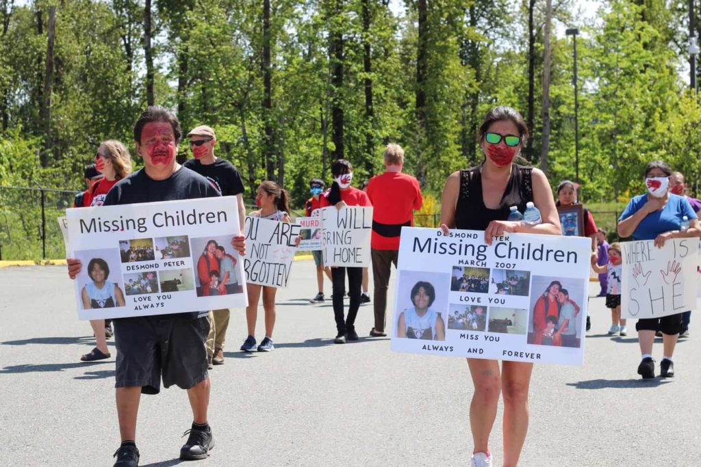 Casey Peter and Elizabeth Louie hold posters of their missing son Desmond Peter at a demonstration in Duncan on May 9, 2020. Jacqueline Ronson/The Discourse Cowichan