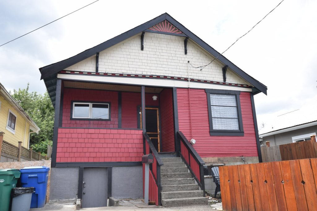 A newly restored heritage home on Haliburton Street shines in pink paint.