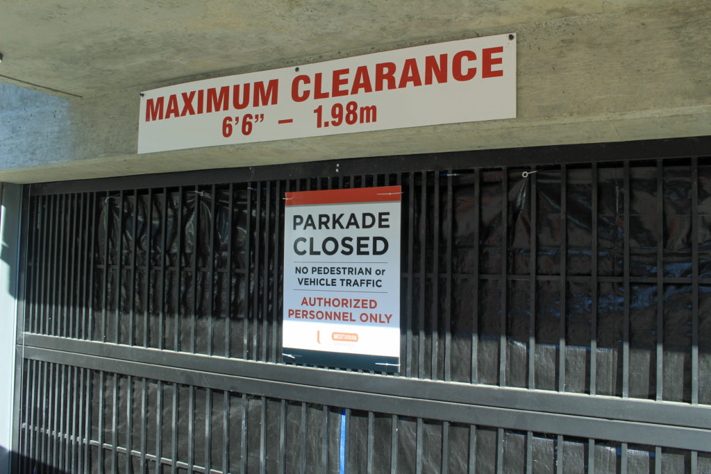 A "closed" sign on a building parkade entrance