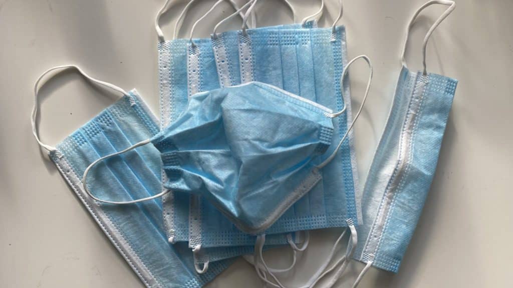 A pile of blue disposable masks, worn to prevent transmission of COVID-19.