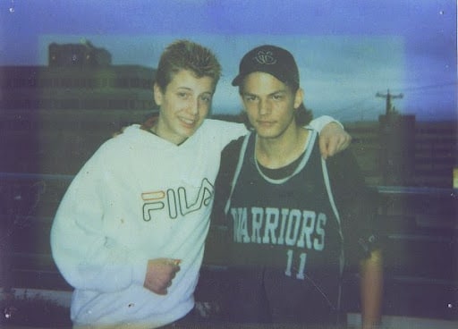 Matt Dunae, left, holds his arm around his brother Nick in 1998.