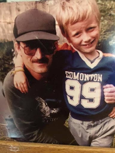 A young, blonde-haired Matt holds his arm around his father, who was in and out of his life until he died.