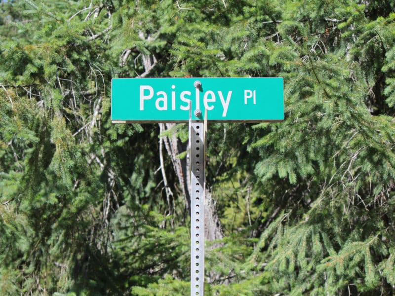 A street sign displays Paisley Place the site of a future affordable housing project.