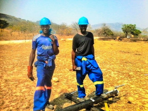 rural-electrification-agency-employees-work-on-a-rural-electricity-project-in-mpudzi-resettlement-scheme