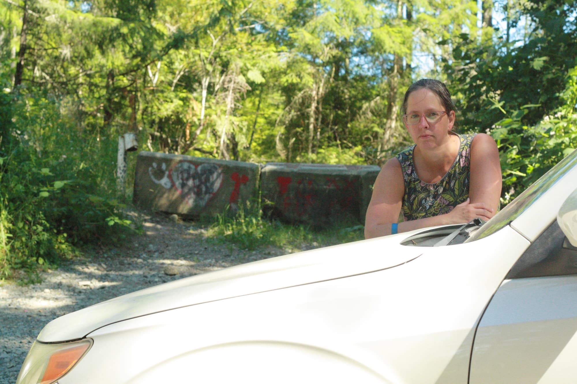 Sarah Webber stands beside her vehicle on Nanaimo Lakes Road where her car theft took place.