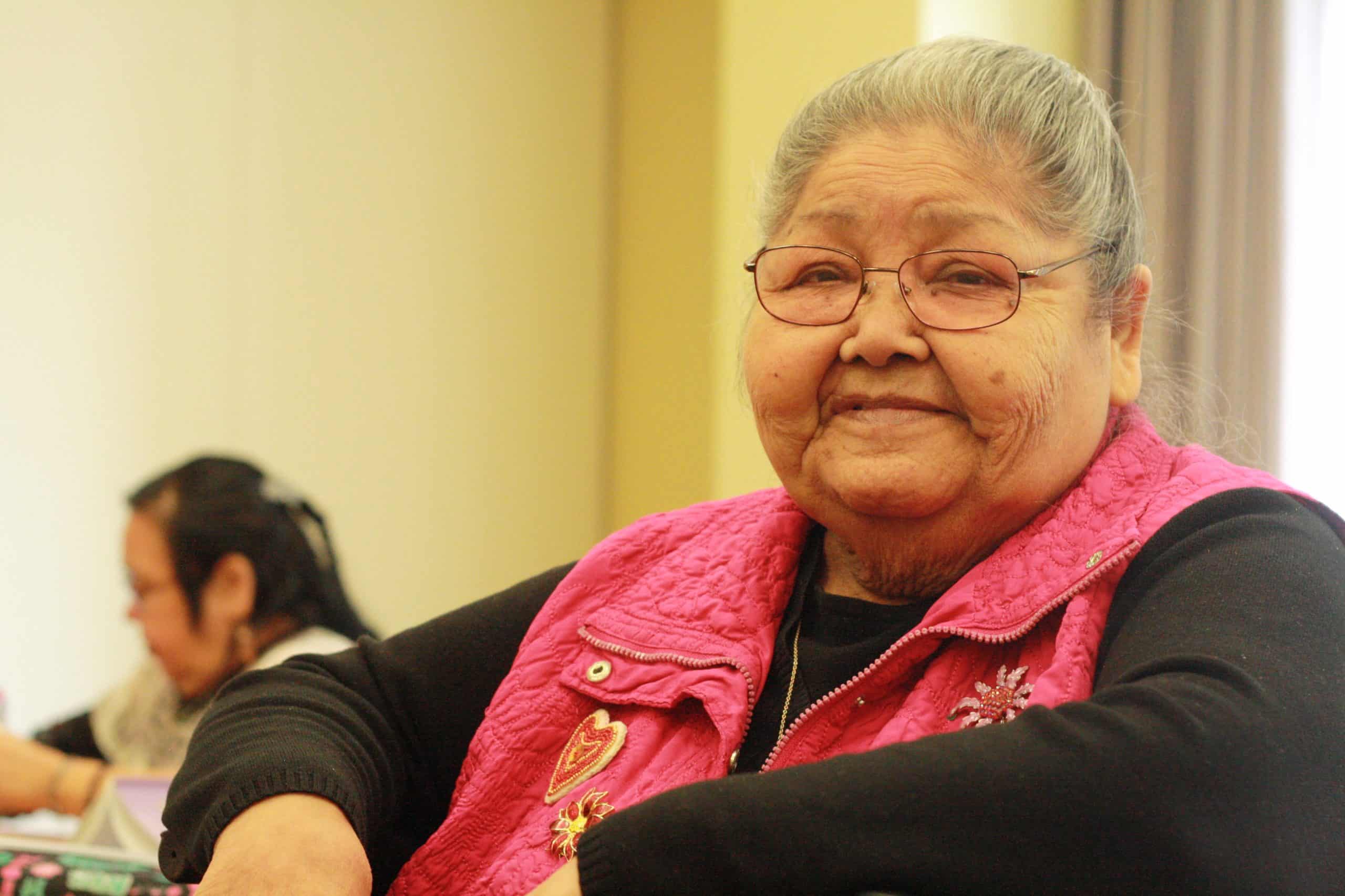 Elder Yvonne Frenchie smiles at the celebration of the expansion of FEATHERS literacy circle.