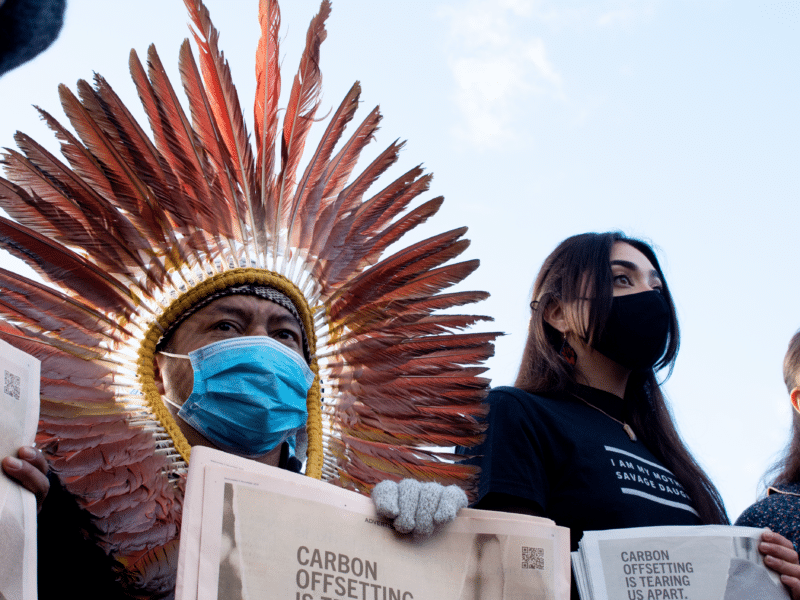 An action held outside the COP26 venue by the Indigenous Climate Action and Indigenous Environmental Network to protest carbon offsetting.