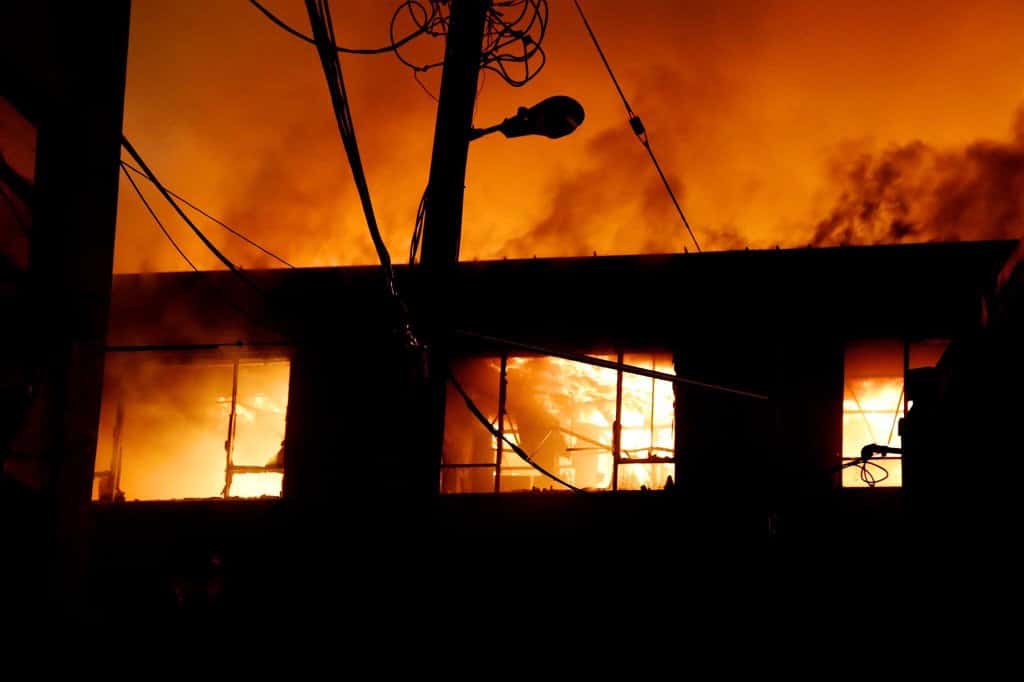 The Hired Guns Creative studio is pictured engulfed in flames from the Jean Burns building fire of 2016.