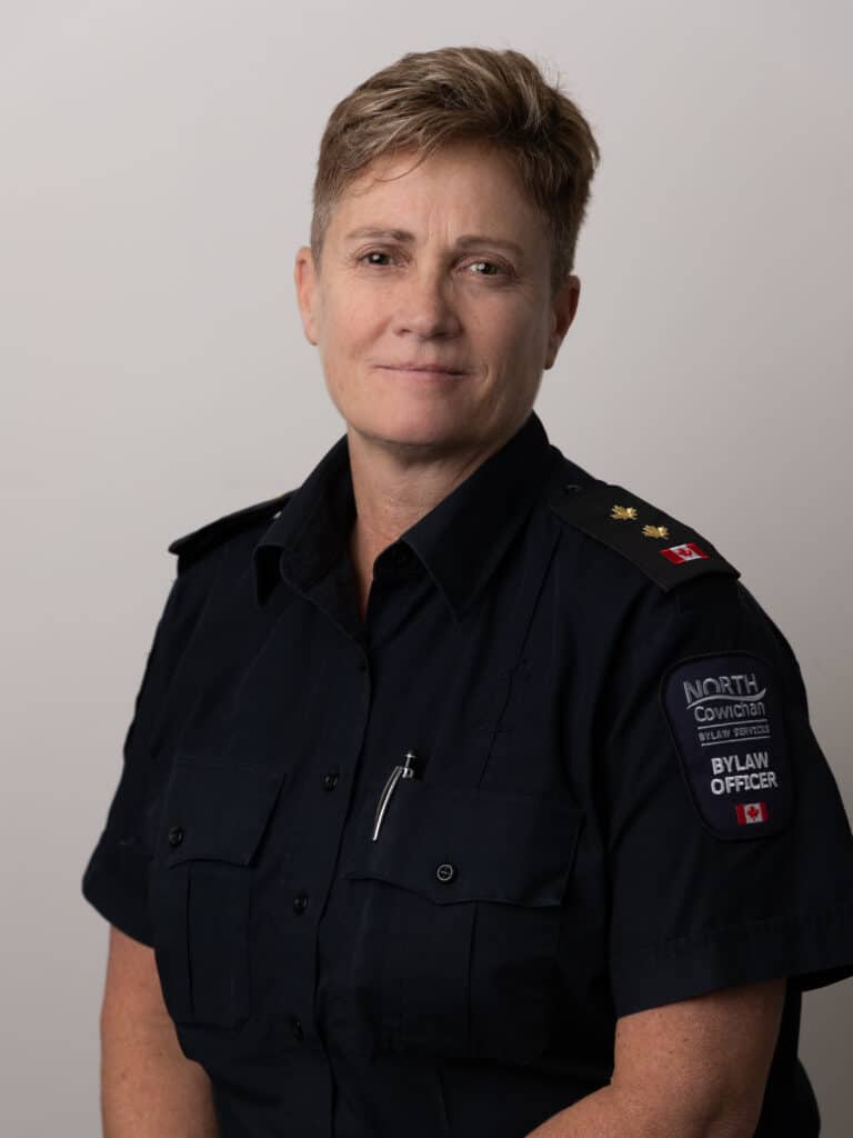 A headshot of Kim Ferris from waist-up. Ferris is wearing her uniform.