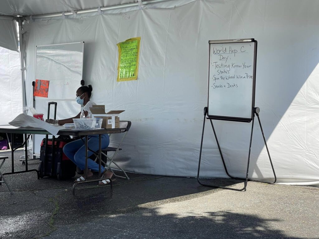 Nurse volunteer offering education around Hepatitis C at NANDU location.