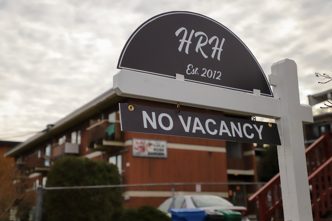A "no vacancy" sign outside a residential building.