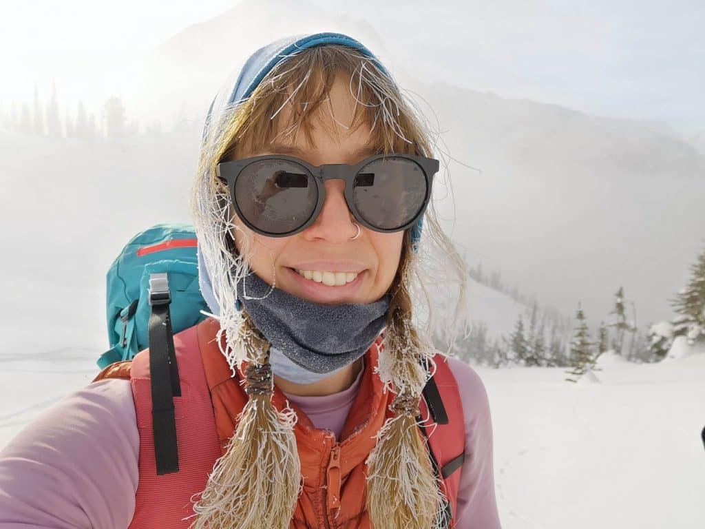 Madeline in a snowy mountain scene.