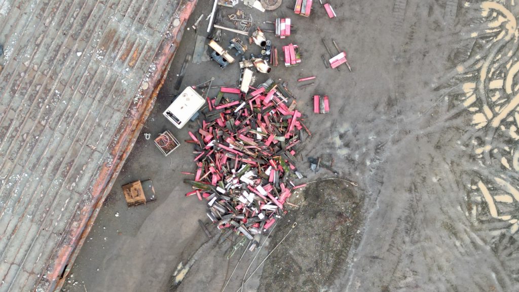 Scap metal piled on a beach