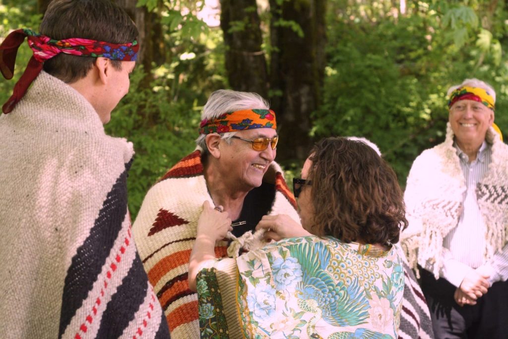 Lyackson Chief Pahalicktun is smiling while he is blanketed.