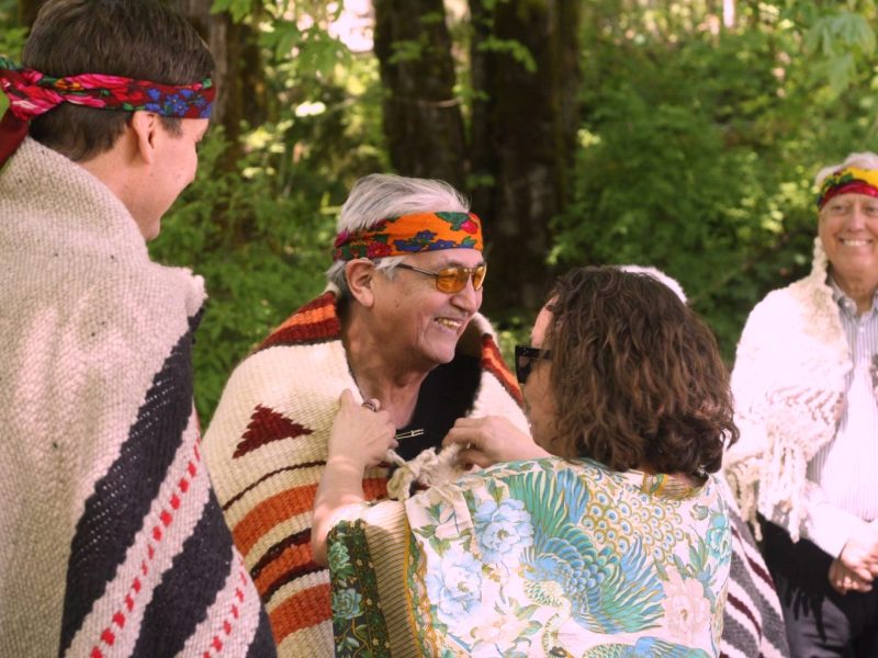 Lyackson Chief Pahalicktun is smiling while he is blanketed.