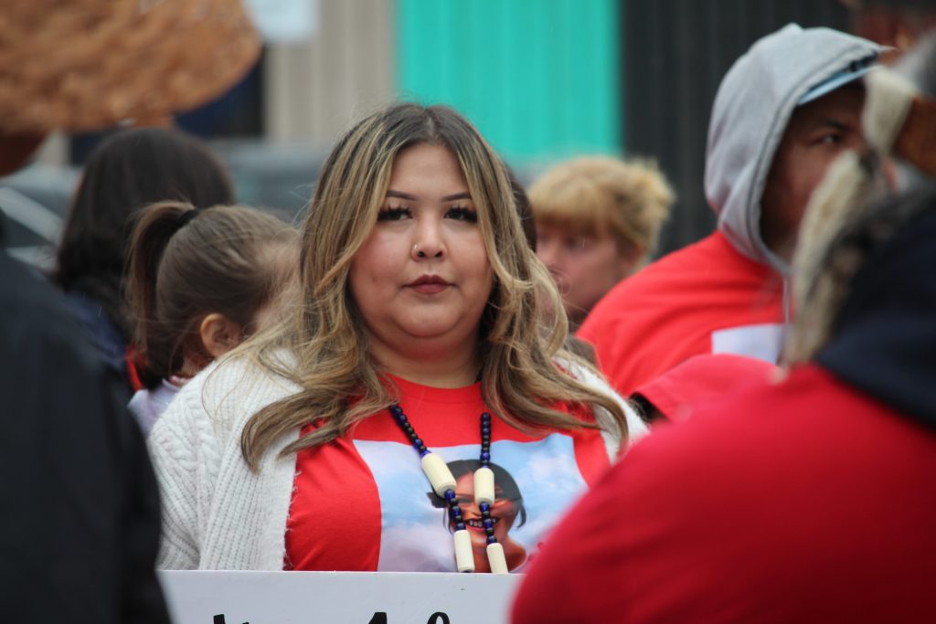 Marie Seaweed stands amongst a crowd of people.