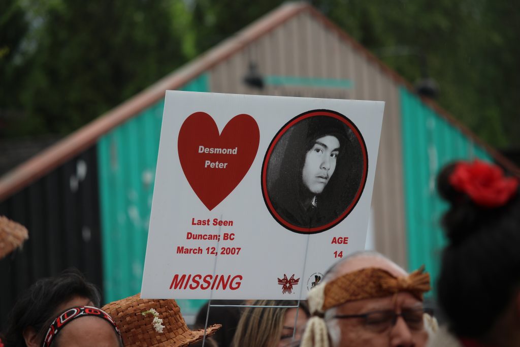 A sign with a photo of Desmond Peter and his name in a heart. It reads "last seen Duncan, BC, March 12, 2007. Age 14. Missing."