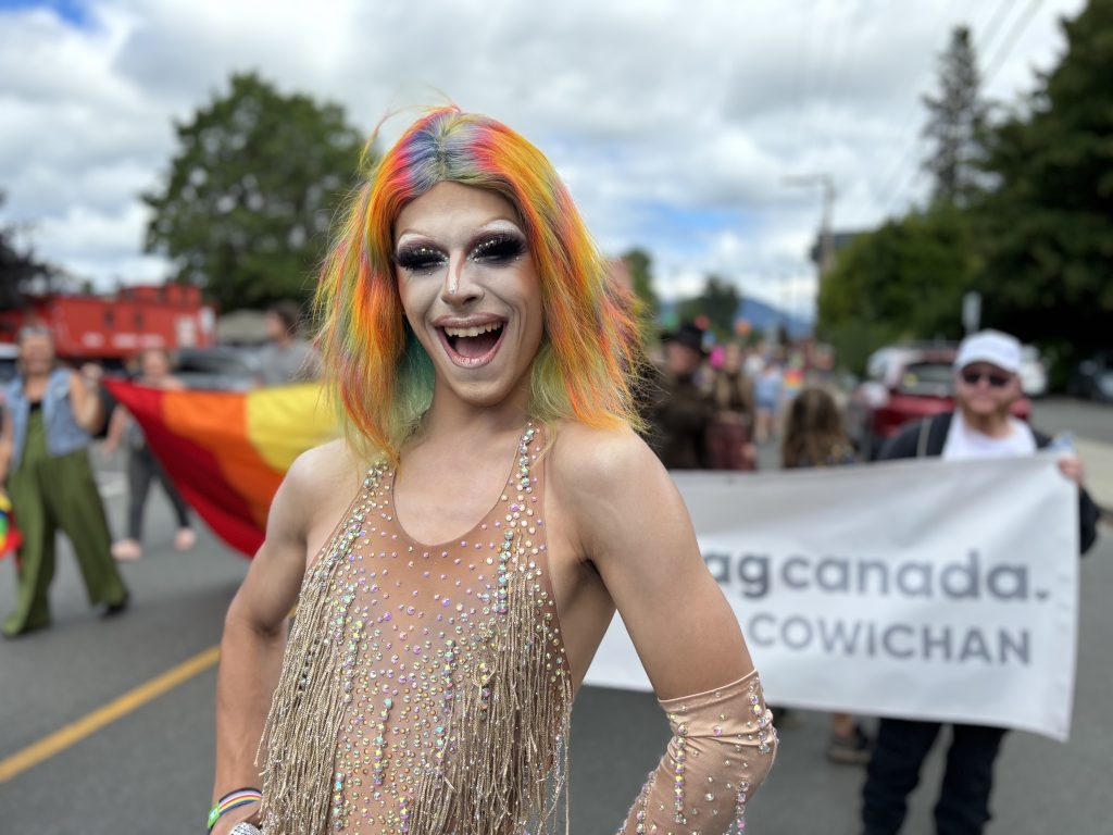 Drag performer Jerriana struts and smiles at the camera