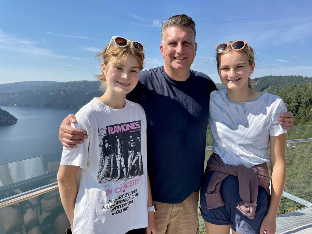 Jordan Kawchuk stands with his daughters at the Malahat Skywalk in the Cowichan Valley.