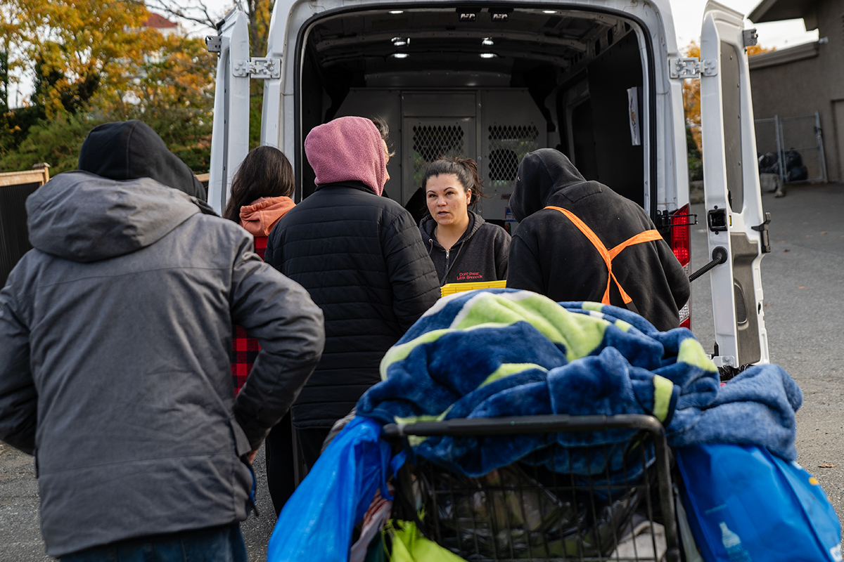 7-10 Club staff hand out food to people experiencing homelessness in Nanaimo on Oct. 20, 2023. File photo courtesy of Mick Sweetman / CHLY 101.7FM Local Journalism Initiative.